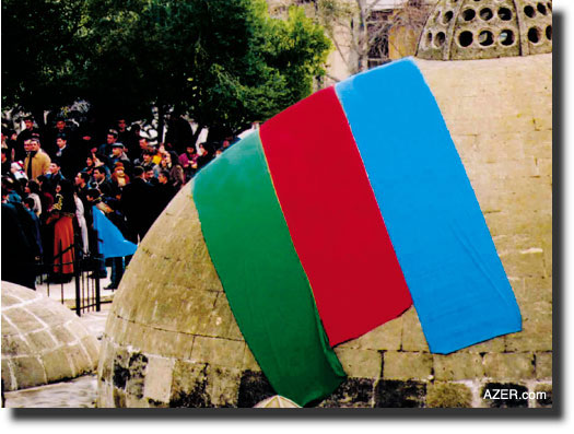 Baku's Inner City where the domes of an old bath house are draped in the colors of the national flag.  Jeff Cornish