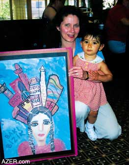 Sharon Hamilton, with her daughter Hannah, who chose the artistic work of Sabina Rashtiyeva, 8.